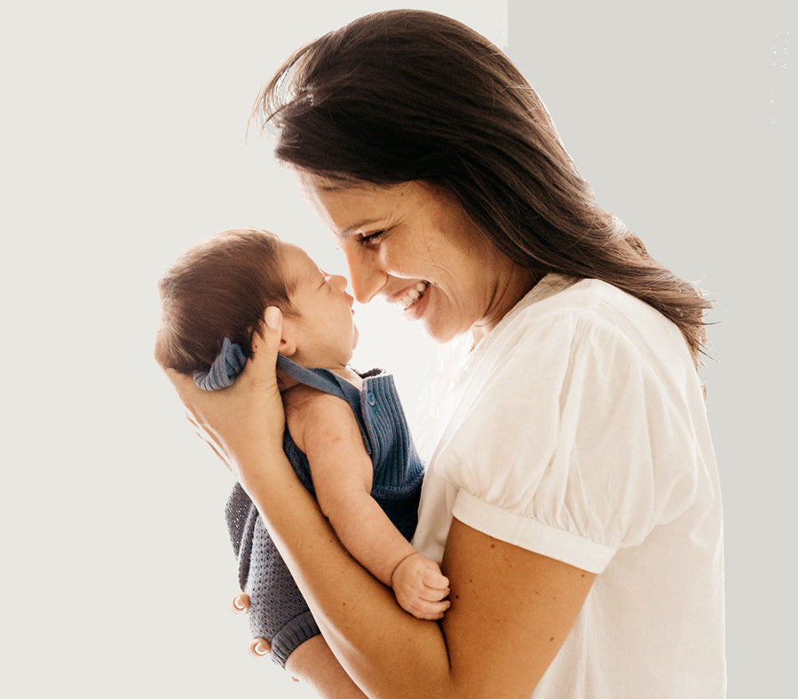 Image of mother kissing her baby's cheek